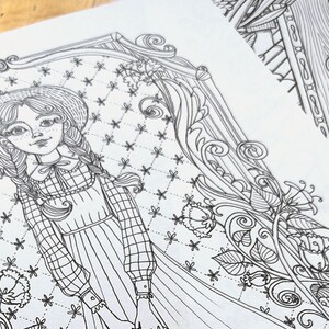 May include: A black and white line drawing of a girl wearing a dress and a hat, holding a suitcase. The girl is standing in front of a patterned background with flowers and swirls.