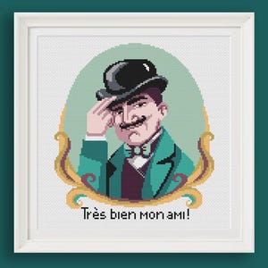 May include: Cross-stitch art of a man in a black bowler hat, green jacket, and purple vest, saluting. The image is framed in a white square frame. Text at the bottom reads "Très bien mon ami!"