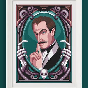 May include: Framed cross-stitch art featuring a portrait of a man with a mustache, dressed in a suit, with a finger to his lips. The artwork is surrounded by a decorative frame with skull and skeletal hand accents, in shades of purple, green, and brown.