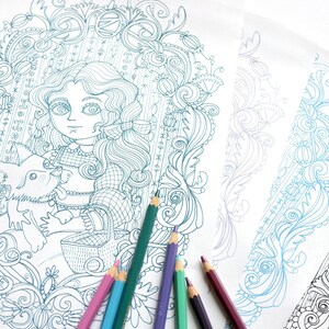 May include: A coloring book page with a detailed illustration of a girl and a dog. The girl has long, curly hair and is wearing a dress. The dog is sitting next to her. The page is surrounded by a border of intricate designs. There are six colored pencils on the page.