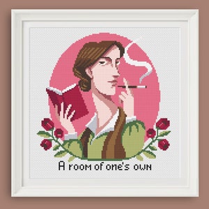 May include: Cross-stitch pattern featuring a portrait of a woman holding a book and smoking a cigarette. The woman is surrounded by pink roses and the text "A room of one's own".