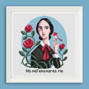 May include: Cross-stitch pattern featuring a woman with dark hair and a red bow tie, holding a small red bird. The background is blue with red roses and green leaves. The text "No nightmares" is below the woman.