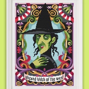 May include: A cross-stitch pattern featuring a portrait of the Wicked Witch of the West from the Wizard of Oz. The witch is wearing a black hat and a green dress. The background is a colorful floral design with the text "Wicked Witch of the West".