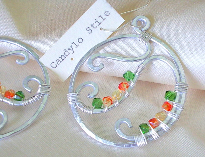 Hoop earrings handmade with hammered aluminum and faceted beads