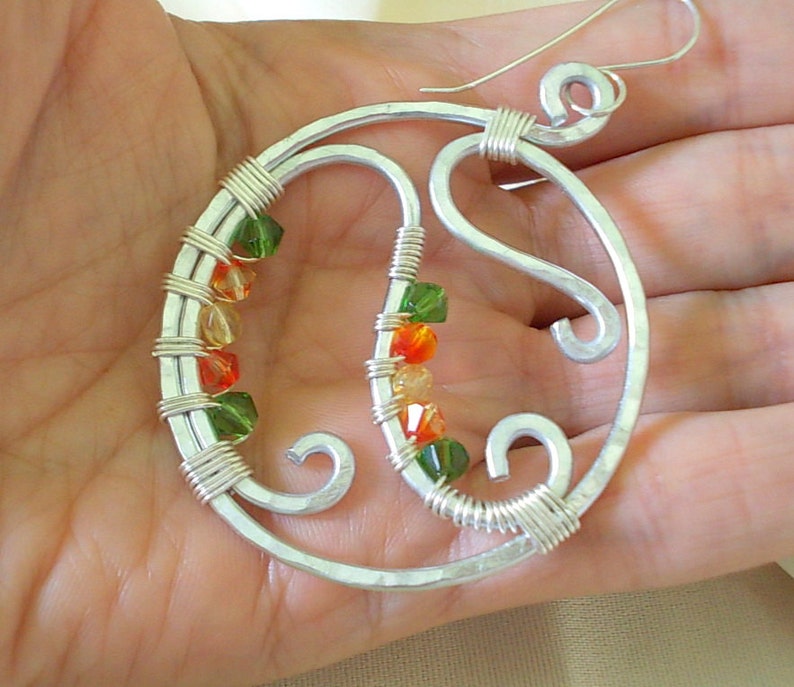 Hoop earrings handmade with hammered aluminum and faceted beads