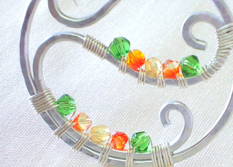 Hoop earrings handmade with hammered aluminum and faceted beads
