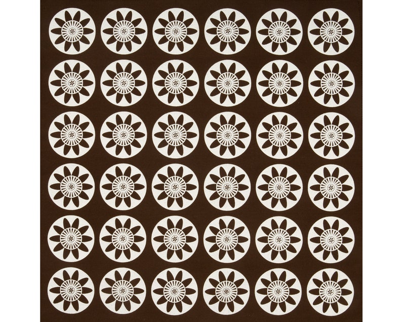 May include: A brown background with a repeating pattern of white stylized flowers. Each flower has 12 petals and a circle in the center.