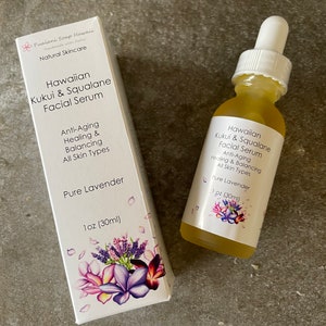 May include: A bottle and box of Hawaiian Kukui & Squalane Facial Serum. The serum is labelled "Pure Lavender" and is for anti-aging, healing, and balancing all skin types. The box and bottle feature floral designs and the product is 30ml.