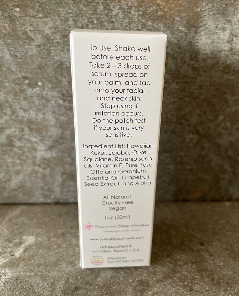 May include: A white product box with text detailing usage instructions and ingredients, including Hawaiian Kukui and Rosehip seed oils. The box is labeled "All Natural, Cruelty Free, Vegan" and contains 30ml of product. The brand name is Pualani Soap Hawaii.