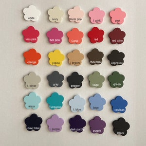 May include: A chart of 25 different color swatches in the shape of a flower. The colors are labeled with their names, including white, ivory, blush pink, I. pink, pink, kiss pink, hot pink, coral, red, red wine, orange, yellow, I. brown, chocolate, espresso, I. silver, gray, pepper, sage, green, aqua, turquoise, I. blue, blue, ceulean, navy blue, I. purple, dark purple, purple, and black.