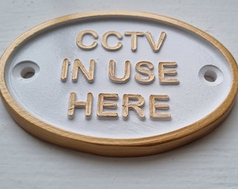 Cctv in use here   White & Gold