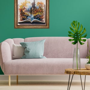 May include: A framed painting of a book with a castle scene inside. The book is open and the castle is in the background. The scene is set in an autumn forest with trees and a waterfall.