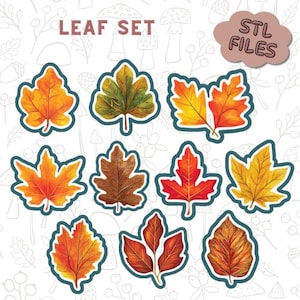 May include: A collection of colorful leaf designs in shades of orange, yellow, red, and brown, each with a dark blue outline. The text "LEAF SET" is at the top, and a cloud-shaped graphic reads "STL FILES". These designs are likely for crafting or digital use.
