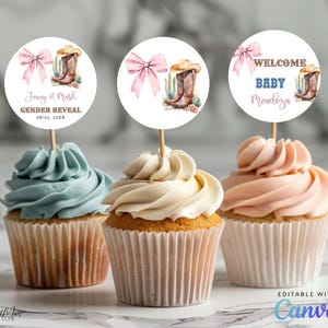 May include: Three cupcakes with toppers for a gender reveal or baby shower. The toppers feature a pink bow, cowboy boots, and cactus. Text on the toppers reads "Jenny & Mark Gender Reveal" and "Welcome Baby Mendoza". The cupcakes have blue, white, and pink frosting.