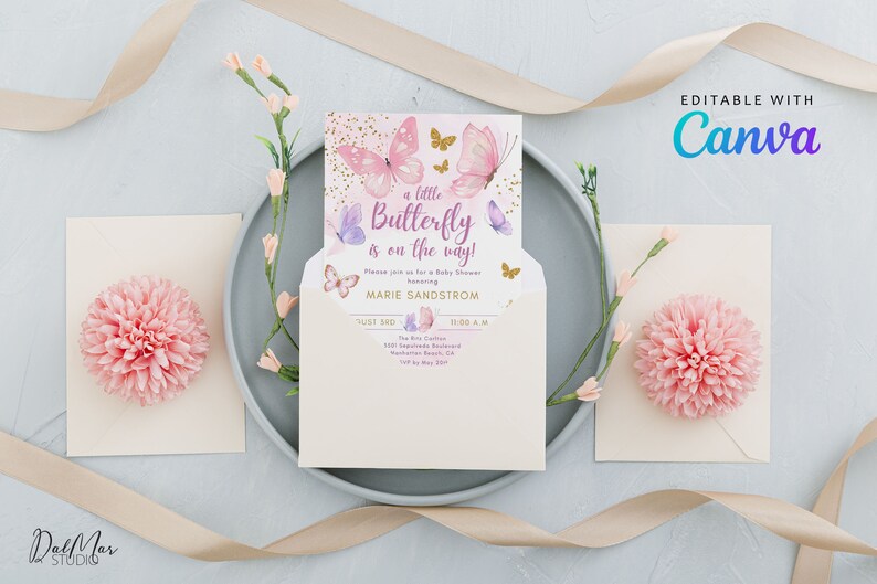 May include: A baby shower invitation with a butterfly theme. The invitation features pink and purple butterflies and the text "a little Butterfly is on the way!". The invitation is inside a cream-colored envelope, with pink floral accents.