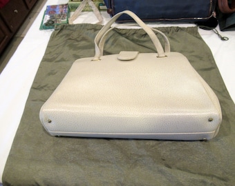 LL ivory-colored purse, multiple compartments, c. 1970s