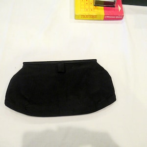 Bobbie Jerome black faille fabric clutch purse, peach satin interior, c. 1960s
