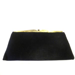 Black fabric clutch purse with gold wingtips clasp, c. 1960s