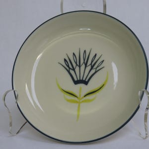 May include: A handmade wooden sign with the text "Welcome" in a playful font. The sign features a distressed finish and a natural wood grain background. A small, decorative heart is attached to the bottom.