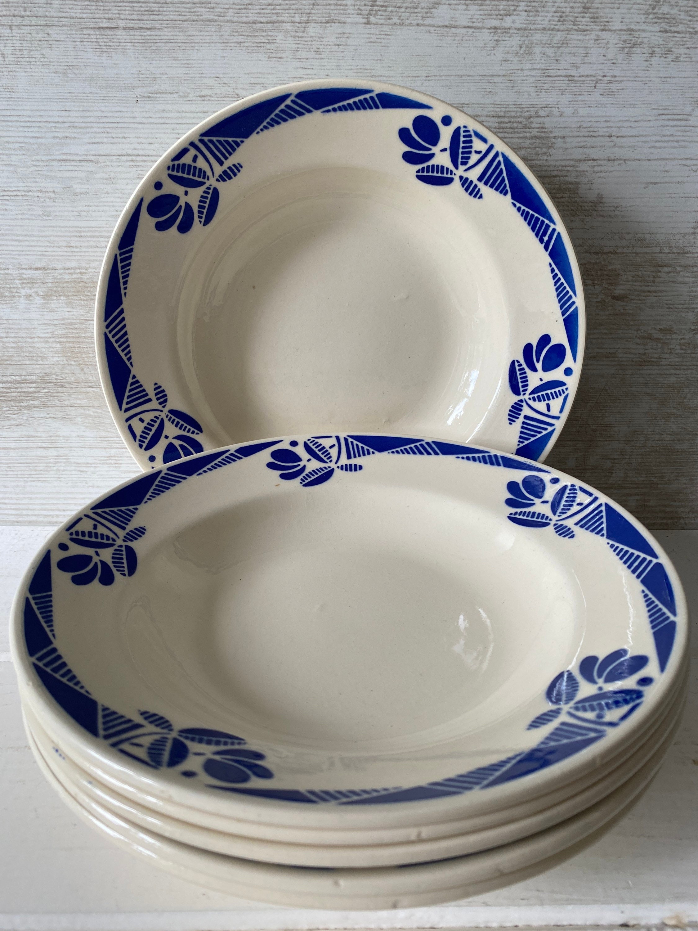 transferware glazed ceramics Pair of antique French lunch or diner plates cream colored with flowers in blue decor