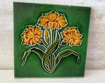 Gorgeous Majolica raised flower tile, antique ceramic tile, original fireplace or wall tile. Decorative tile, green with orange flowers