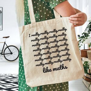 May include: A white canvas tote bag with black text that reads "I really, really, really, really, really, really, really, really, really, really, really, really, really, really, really, really, really, really, really, really, like maths".
