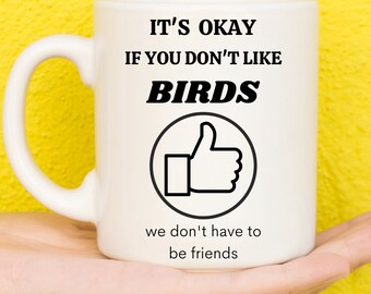 May include: White ceramic mug with a black graphic that says "It's okay if you don't like birds. We don't have to be friends." and a thumbs up icon.