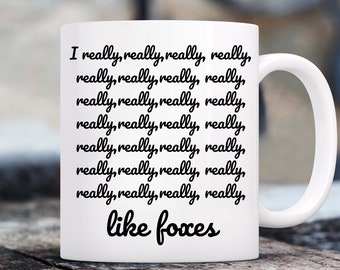 May include: White ceramic coffee mug with black text that reads "I really, really, really, really, really, really, really, really, really, really, really, really, really, really, really, really, really, really, really, really, like foxes".