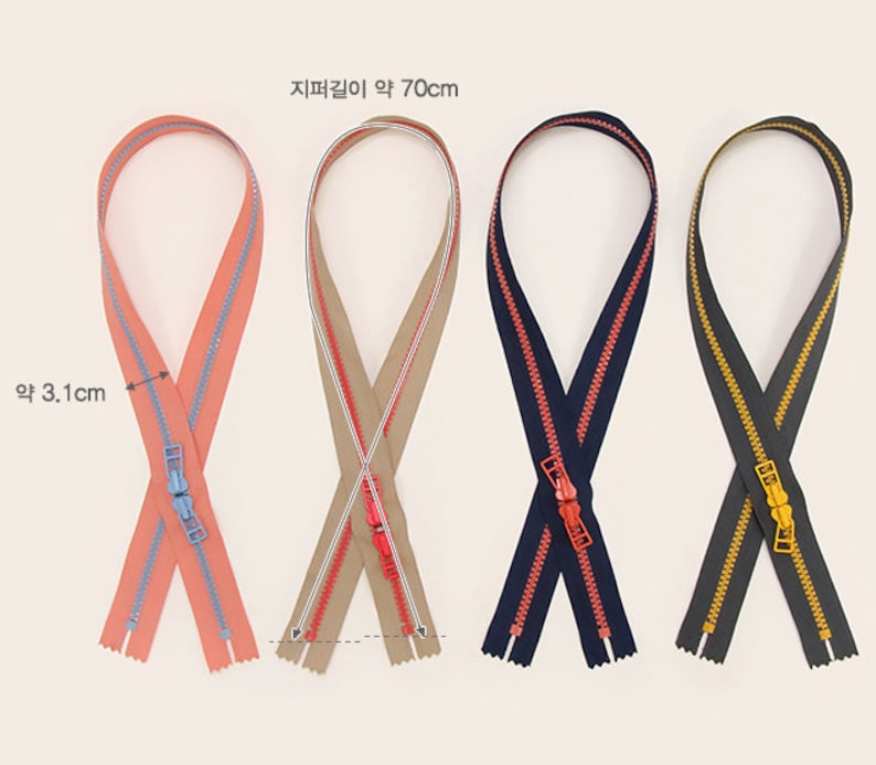 May include: Four zipper closures in different colors: coral with blue trim, beige with red trim, navy blue with red trim, and black with gold trim. Each zipper is approximately 70 cm long and 3.1 cm wide.