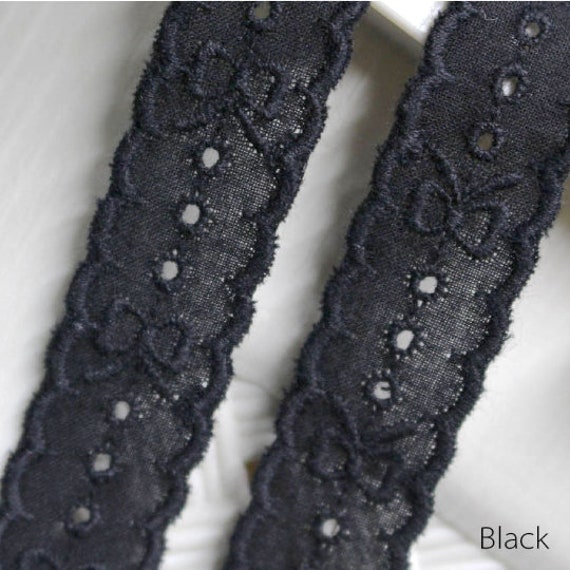 Premium Photo  Black lace ribbon on white