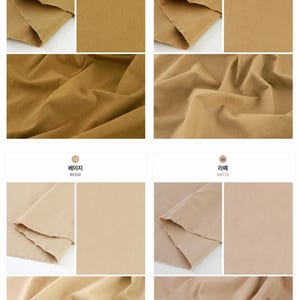 May include: A collection of four fabric swatches in shades of golden, desert, beige, and latte. Each section displays the textile folded and flat, showcasing the solid, matte, neutral-toned material with visible raw edges and soft folds.