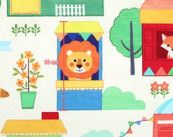 May include: A colorful illustration of a lion peeking out of a yellow and blue booth with a red roof. The booth is 10 cm tall and has a white awning with colorful flags. The lion has a friendly expression and is surrounded by other colorful illustrations of animals and houses.