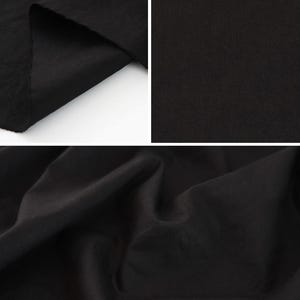 May include: A solid black fabric shown in three different views. The top left panel shows a folded edge, the top right panel displays a flat, smooth surface, and the bottom panel captures the fabric with soft, draped folds and shadows.