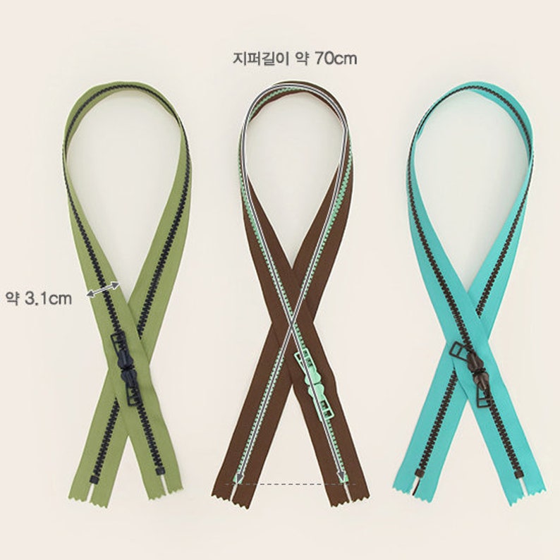 May include: Three zipper closures in different colors: green, brown, and blue. Each zipper is approximately 70 cm long and 3.1 cm wide. The zippers have a black pull tab.