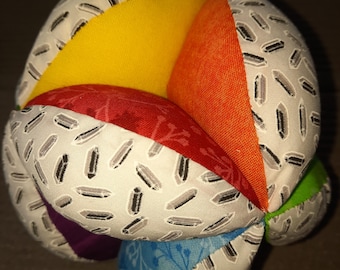 white-grey, colorful gripping ball with clatter, motor skills ball