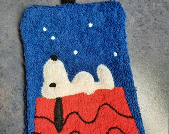 Washcloth with a white dog looking at the starry sky