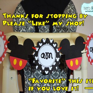 May include: A Mickey Mouse themed birthday banner with red, black and white paper circles. The banner says "one", "am", and "i". The banner is hanging on a high chair. The text "Thanks for stopping by, please "like" my shop!" is at the top of the image. The text "'Favourite' this item if you love it!" is at the bottom of the image.