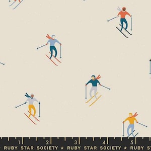 May include: A cream-coloured fabric featuring a repeating pattern of skiers in various outfits. The skiers are in shades of blue, orange, yellow, and black, with red and yellow skis. The text "RUBY STAR SOCIETY" is at the bottom.