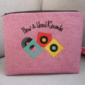 Trousse cosmétique, musique, pochettes de disques, disques neufs et d'occasion, disques vinyles