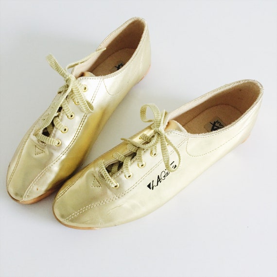 gold tennis shoes