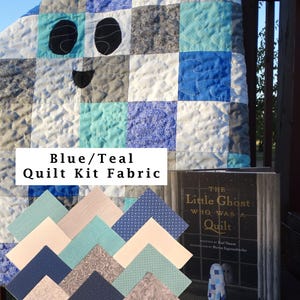 May include: A quilt featuring a ghost face made of blue, teal, and gray fabric squares, accompanied by a stack of assorted blue and gray fabric swatches and a book titled The Little Ghost Who Was a Quilt. Text reads Blue/Teal Quilt Kit Fabric.