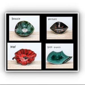 Op de afbeelding: Een witte keramische mok met een zwart handvat en de tekst "But First, Coffee" in een zwarte, handgeschreven lettertype. De mok staat op een wit oppervlak.