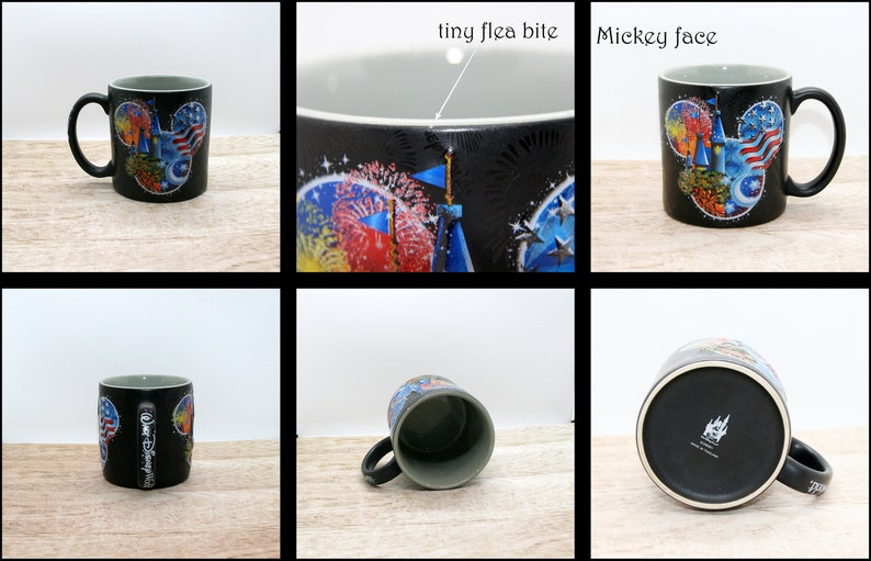May include: Black ceramic mug with a gray interior and a curved handle. The mug features a colorful design of a Mickey Mouse face with an American flag theme, fireworks, and a castle. The mug has the words "Walt Disney World" on the side.