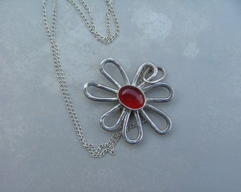 Necklace: Sterling Flower Power necklace with genuine 6 X 8 carnelian cabochon.