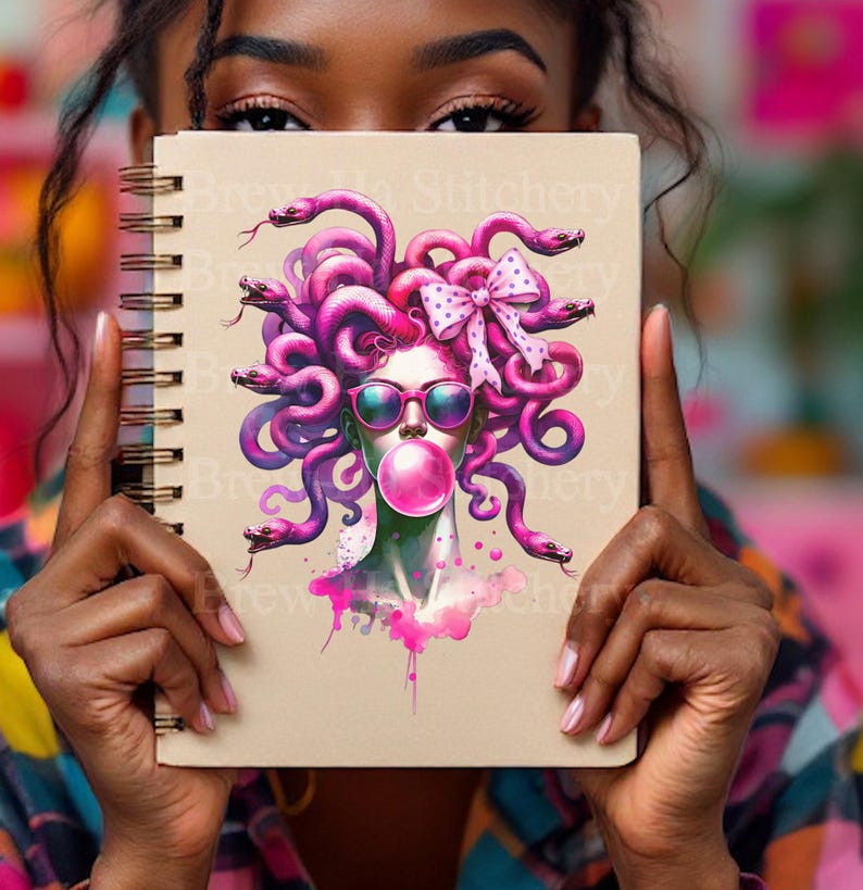 May include: Spiral-bound notebook with a Medusa illustration. The artwork features a woman with pink snakes for hair, sunglasses, and a bubblegum bubble. The design is in shades of pink and purple, with a watercolor effect.