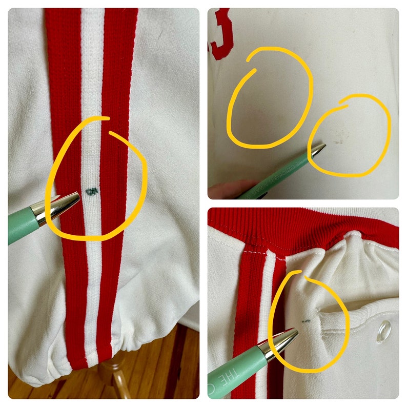 May include: Close-up of a vintage white baseball jersey with red and white stripes down the front. The jersey has a red collar and the number "3" in red on the back. There are some small stains on the jersey.