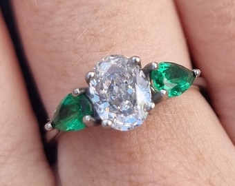 Lab Emerald and White Genuine moissanite Oval & pear cut 3 stone Trilogy Ring in White Gold or Titanium