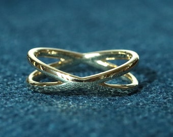 X criss cross style wedding band available in solid gold and platinum