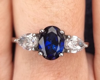 Blue Sapphire and White Genuine moissanite Oval & pear cut 3 stone Trilogy Ring in White Gold or Titanium  - engagement ring - handmade ring