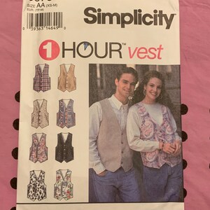 May include: A Simplicity sewing pattern for a vest, with the title "1 HOUR vest". The pattern shows a variety of vest designs, including plaid, paisley, and floral patterns. The pattern is for sizes XS-M.